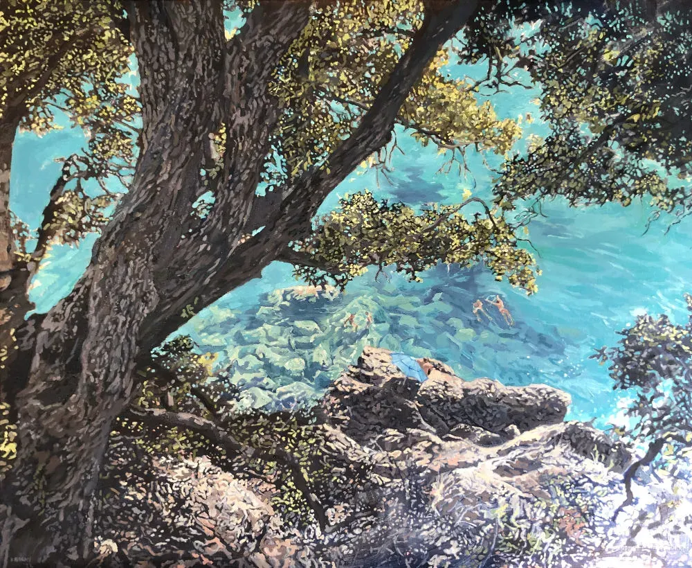 Swimmers in tranquil Mediterranean water below a rocky path.