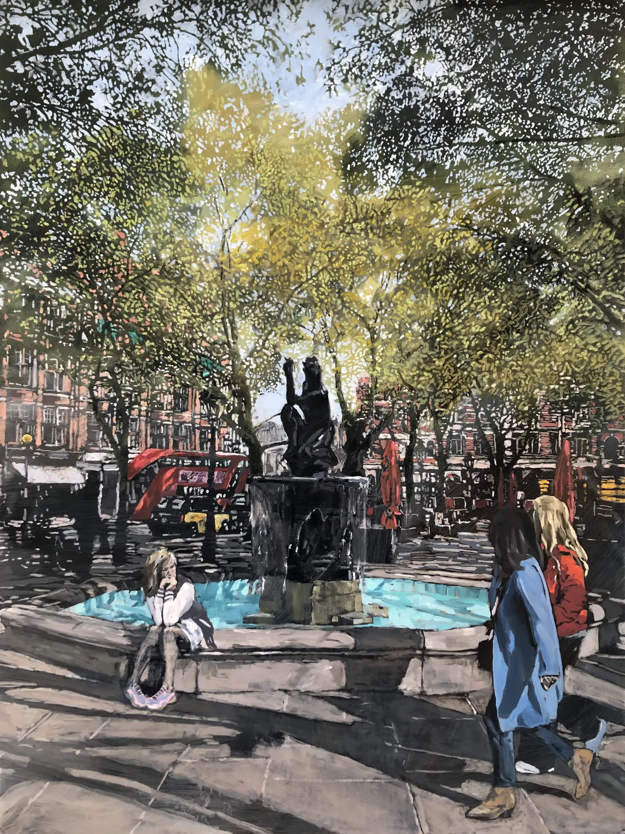 Two pedestrians walking past the fountain in London's Sloane Square.