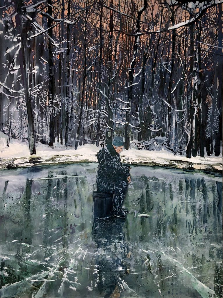 A man sits alone in the middle of a frozen lake.