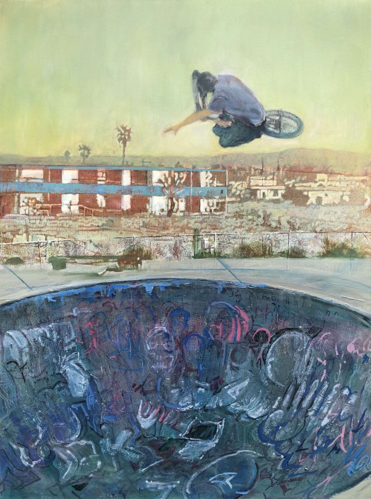A BMX bilker in mid-air doing a stunt at a skate park.