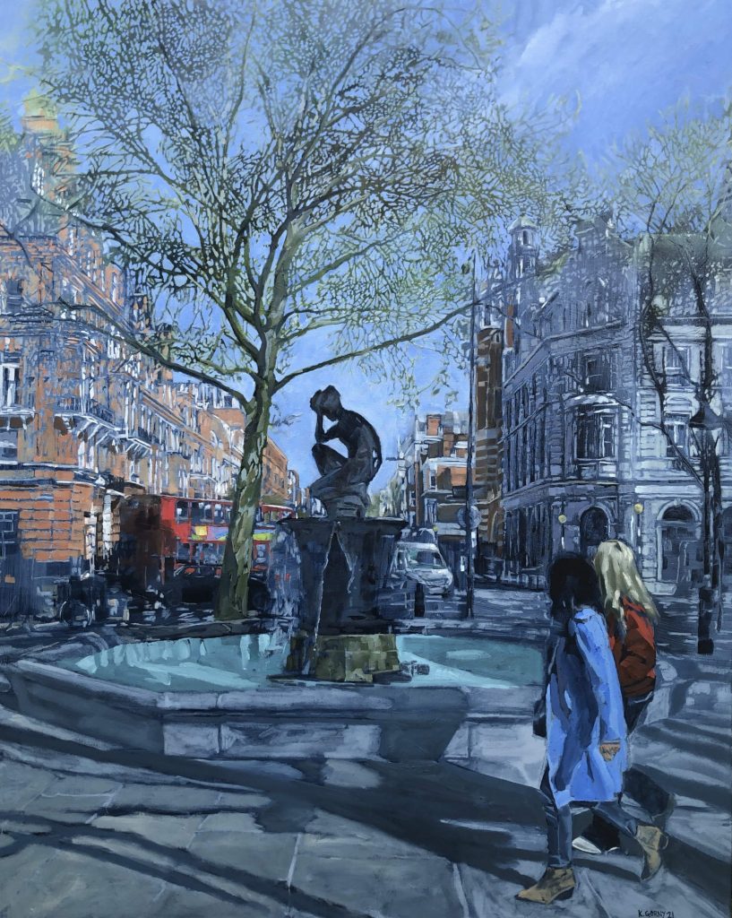 Two padestrians walking past London's Sloane Square fountain.
